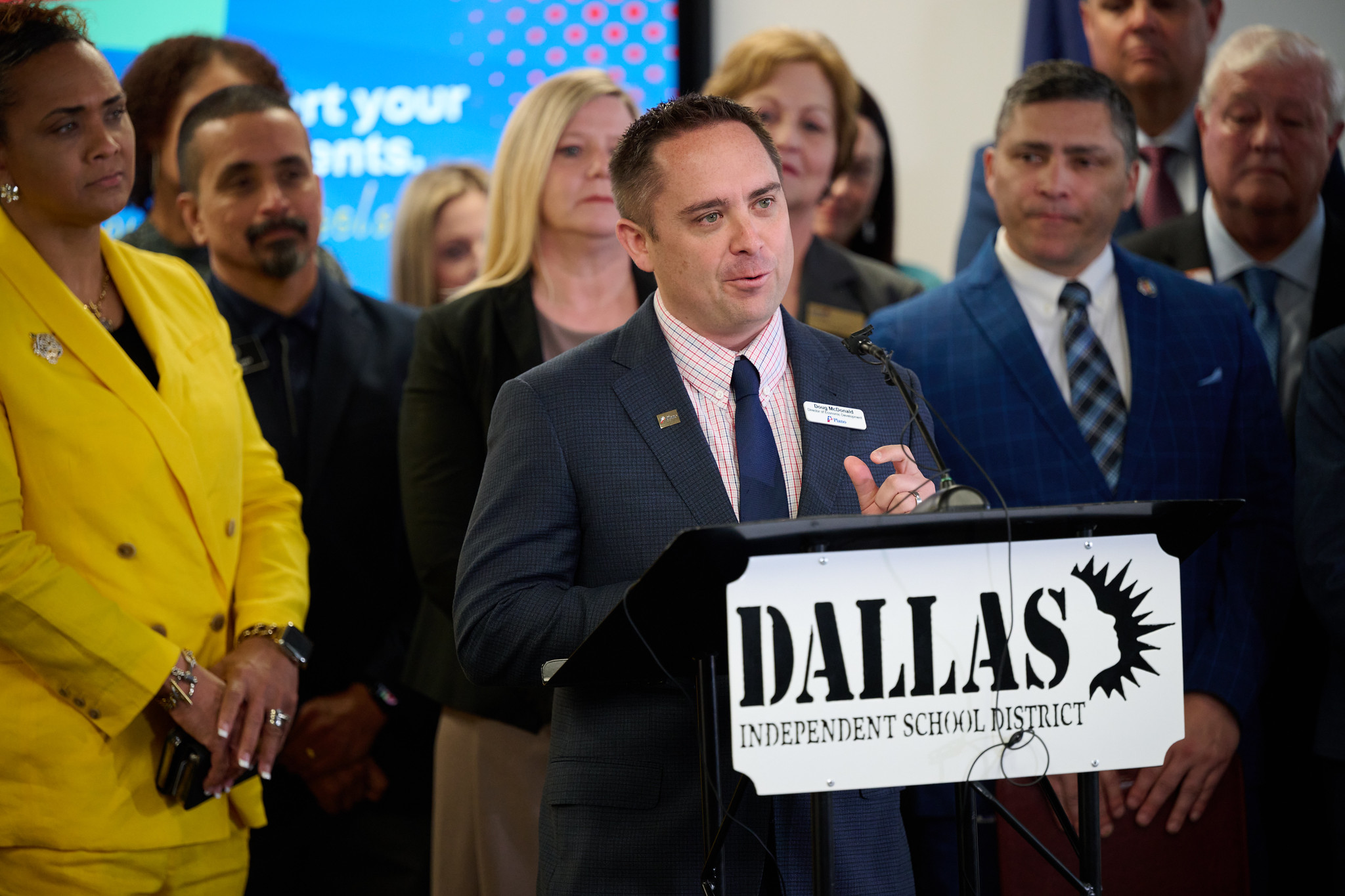 plano economic development director doug mcdonald speaking at podium